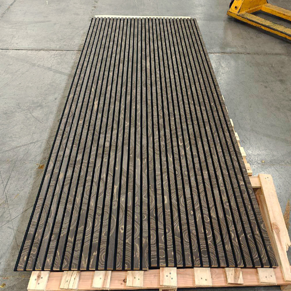 Dark slatted panel resting on supports