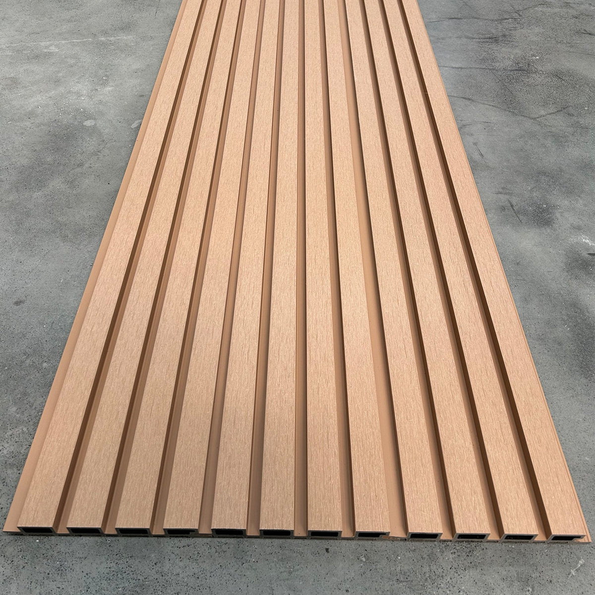 Brown grooved cladding panel displayed flat